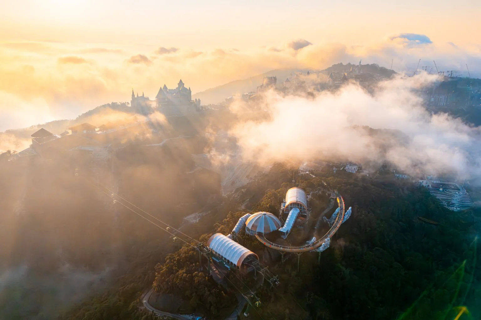 Cable car crossing a cloud-covered mountain slope at Ba Na Hills