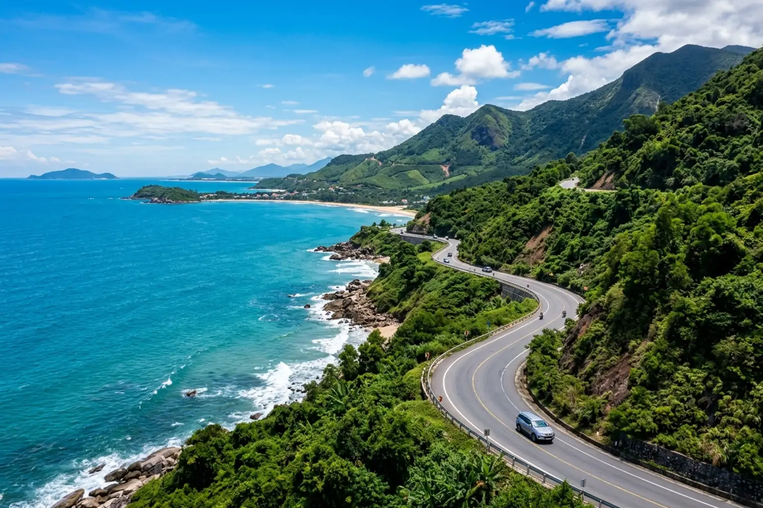 Car driving along the Central Vietnam coast with blue sea and fine sand beaches