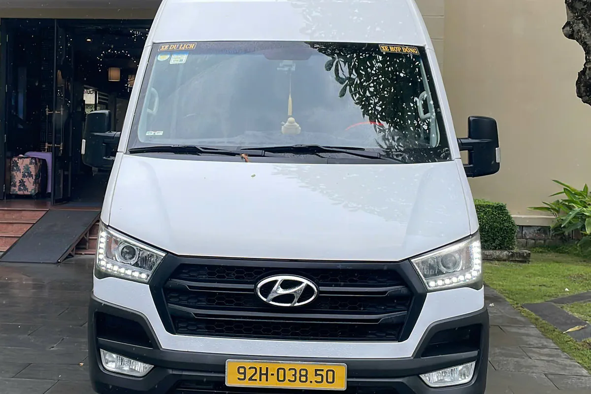 A 16-seat touring van used for multi-day trips in Central Vietnam