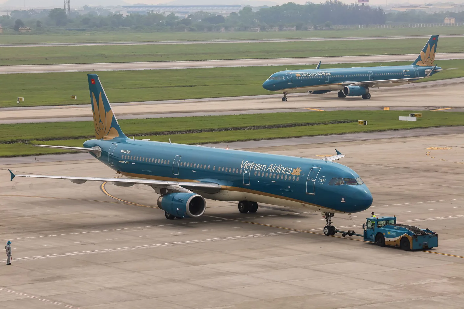 An aircraft beside an airport terminal