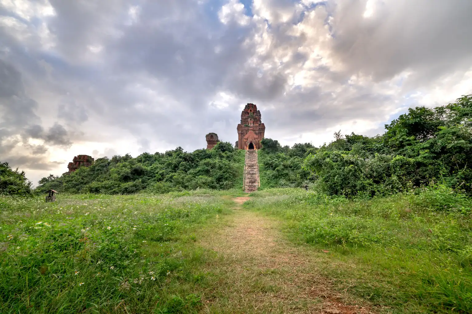 Brick towers at My Son amid greenery