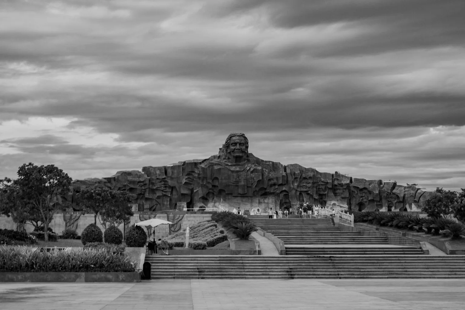 A large stone monument complex seen from the front steps