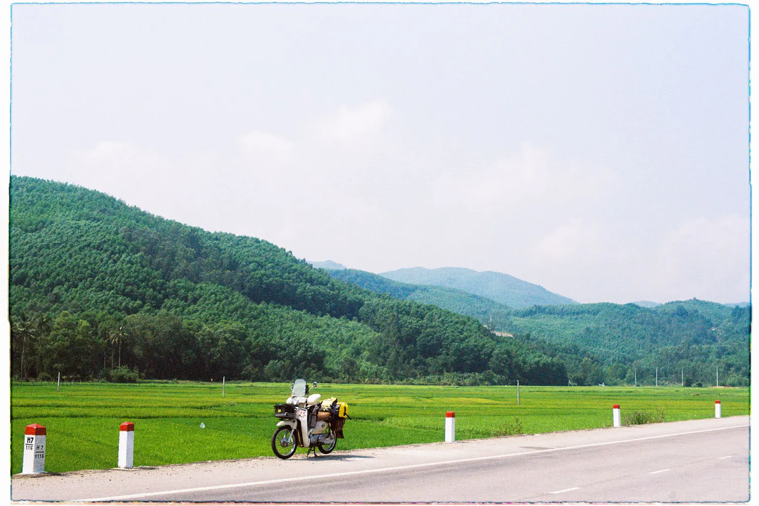 A country road beside green hills in Quang Ngai
