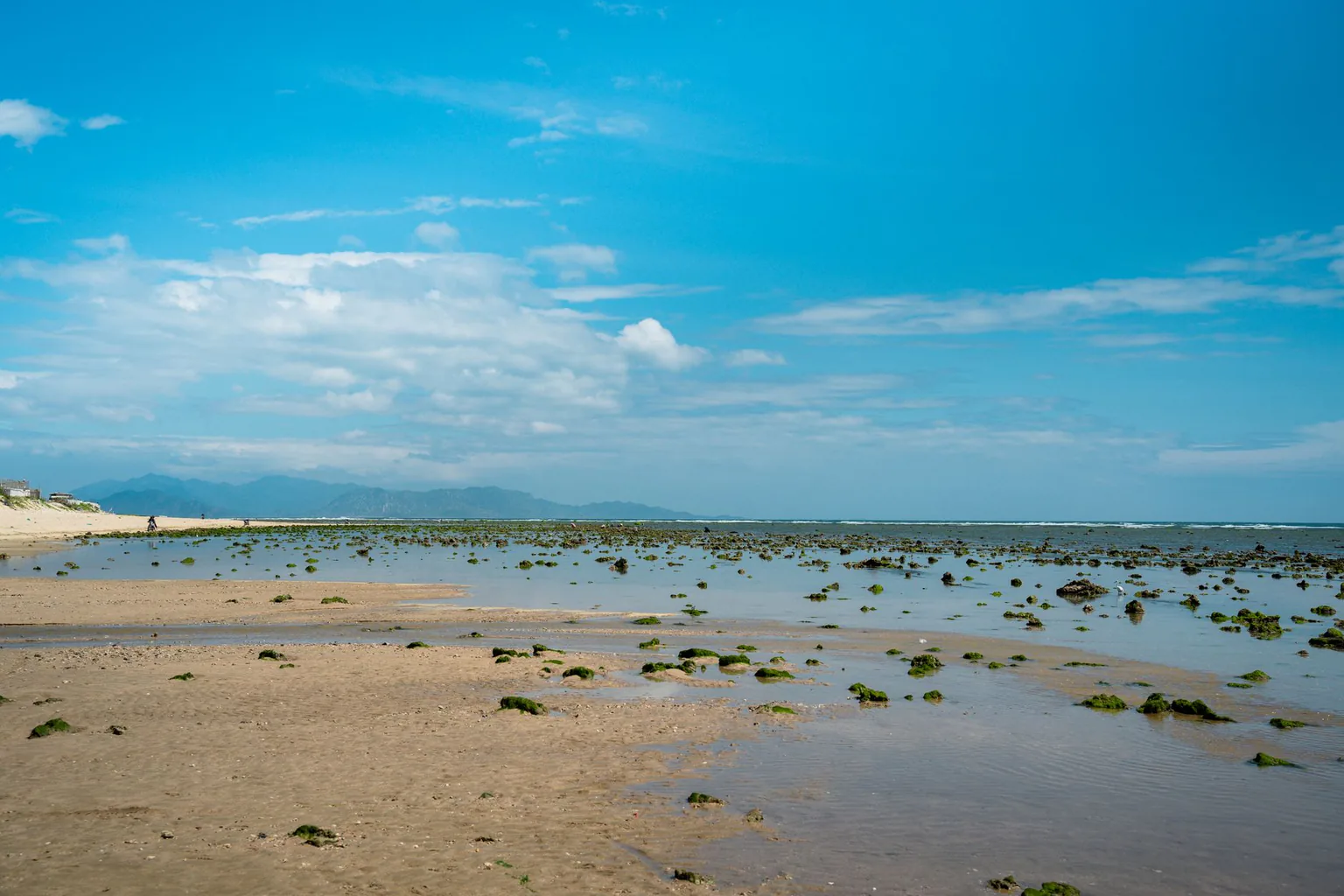 White-sand beach at Tam Ky with the sea beyond