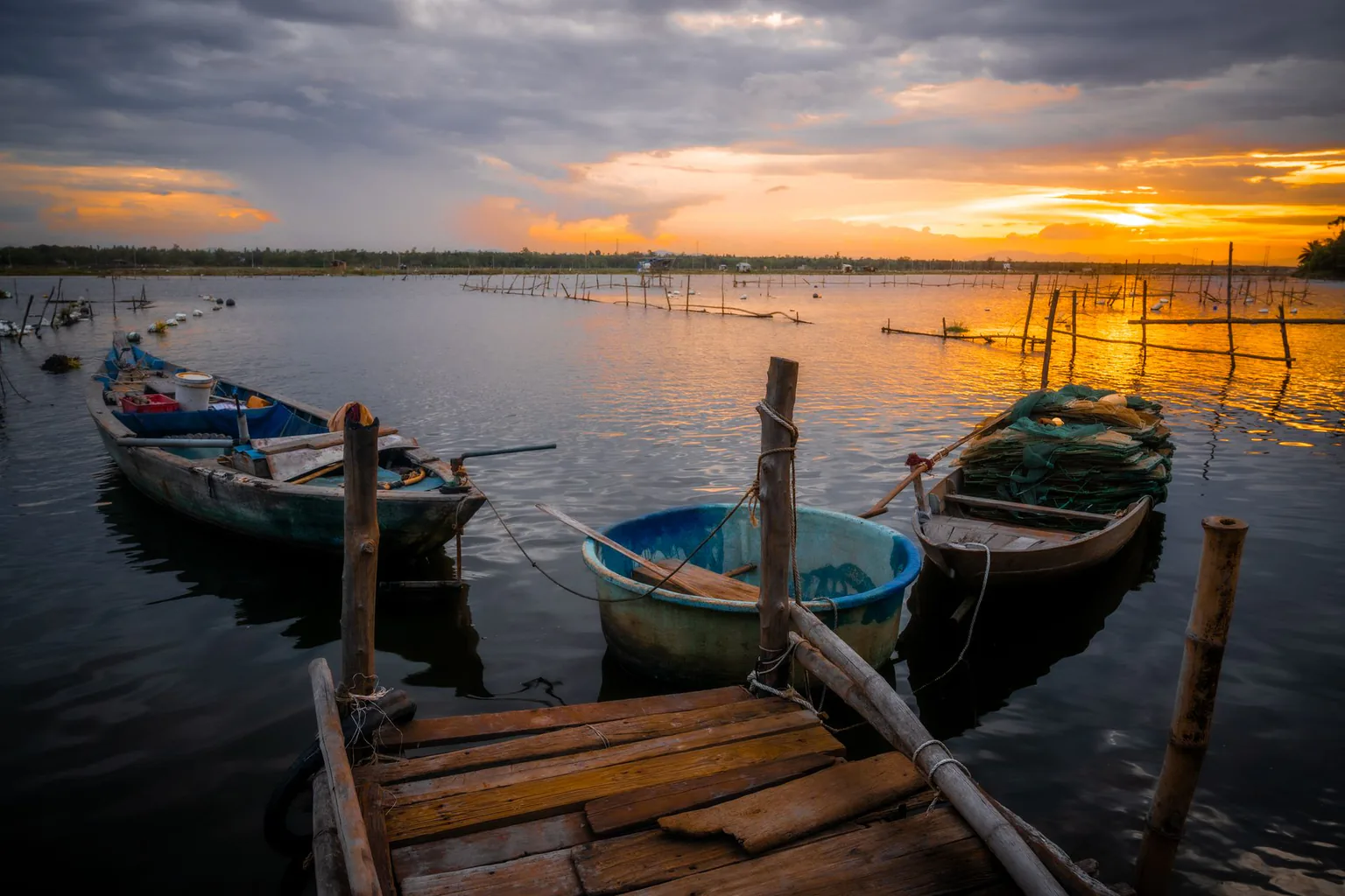 Boats moored on a river in the sunset light in Quang Nam