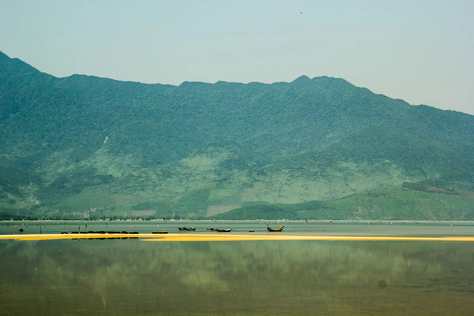 Still lagoon water reflecting the mountain range