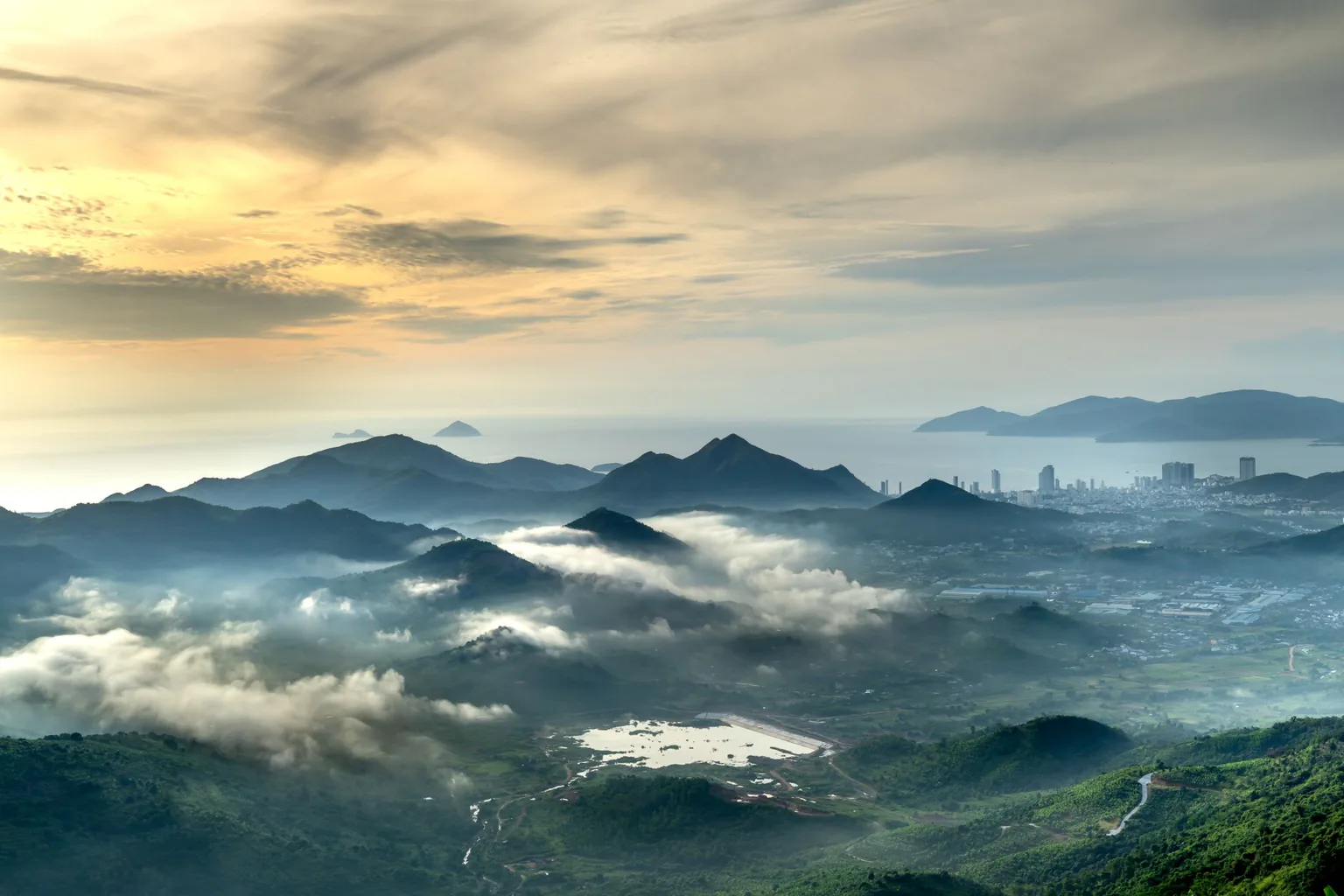 A misty mountain valley at sunrise